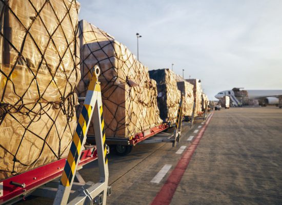 Loading of cargo airplane Loading of cargo containers to airplane at airport.